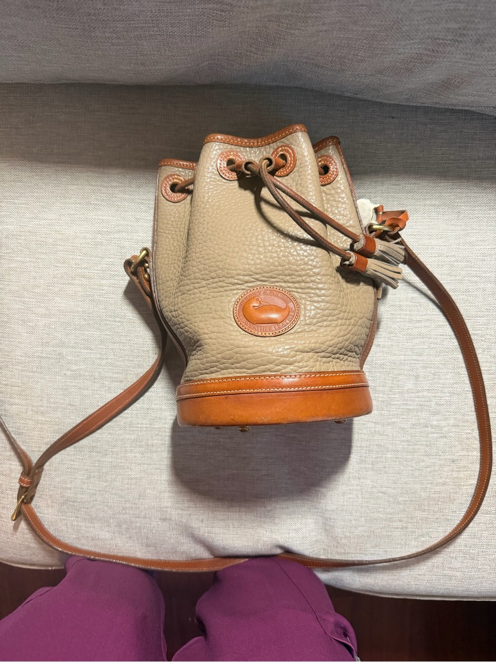 Dooney & Bourke Taupe Pebbled Leather Bucket Bag with Tan Trim